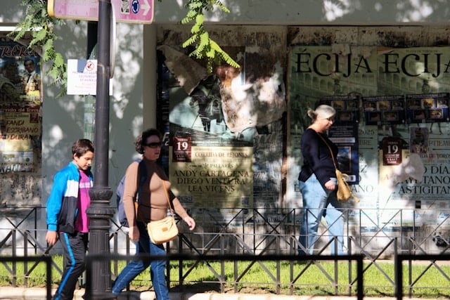 Young Spanish people walking down the street